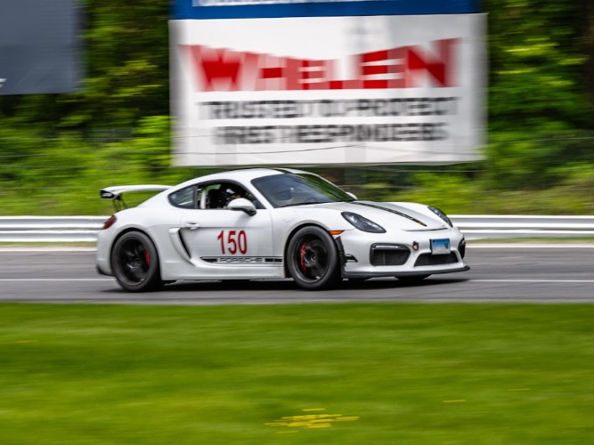 Ben driving a Porsche Cayman GT4 at Lime Rock Park